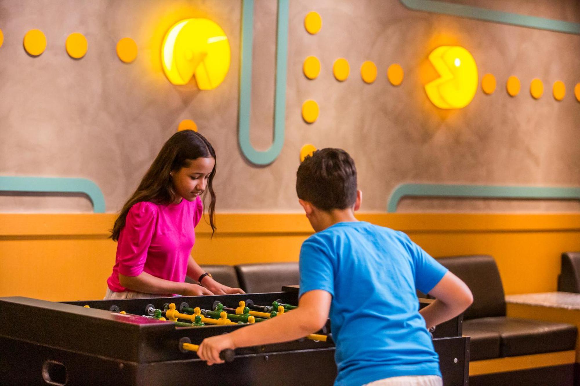 Blue Tree Thermas De Lins Resort Exterior photo Two children playing table football