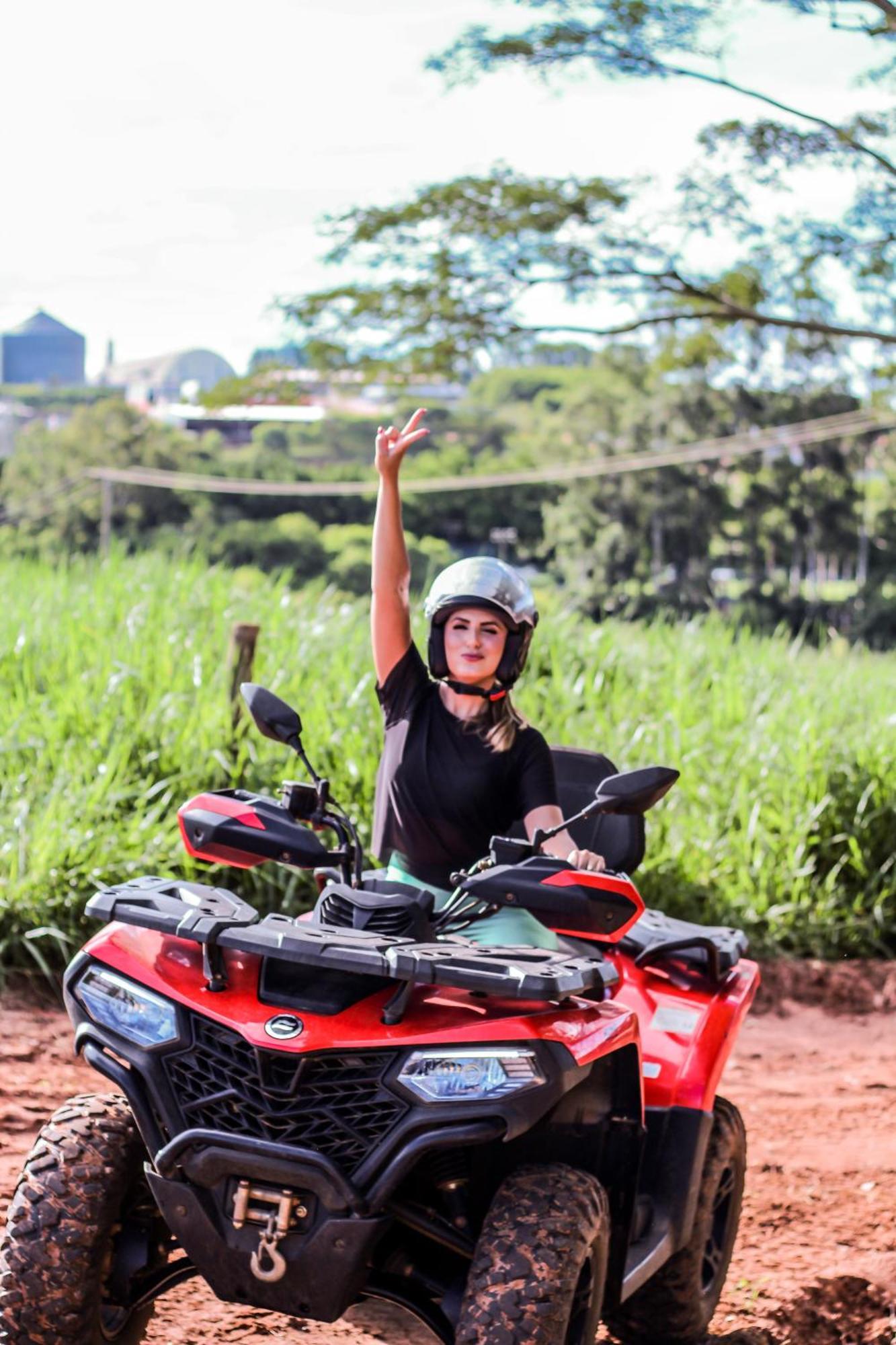 Blue Tree Thermas De Lins Resort Exterior photo A woman on a quad bike